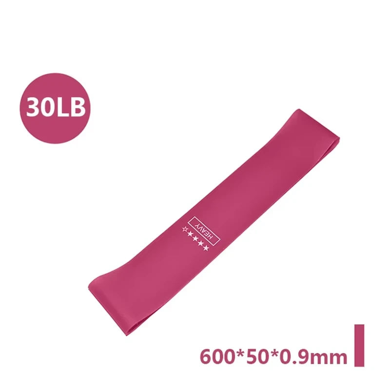 Five resistance bands in varying colors of pink, purple, and blue, labeled with resistance levels and sizes, with a carry bag.